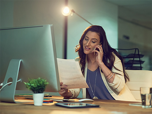 Woman in office on phone